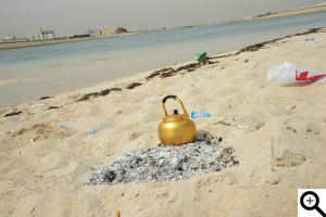 Trash cooking pot left in the beach